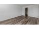 Bedroom with a door and wood floors at 7755 E Quincy Ave # 308A5, Denver, CO 80237