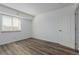 Bedroom with a window and wood floors at 7755 E Quincy Ave # 308A5, Denver, CO 80237