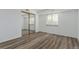 Bedroom featuring a mirrored closet and wood floors at 7755 E Quincy Ave # 308A5, Denver, CO 80237