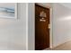 Hallway view of unit door with design and number 308 at 7755 E Quincy Ave # 308A5, Denver, CO 80237