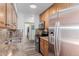 Updated kitchen features stainless steel appliances, granite countertops and wood cabinets at 7755 E Quincy Ave # 308A5, Denver, CO 80237