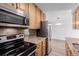 Well-equipped kitchen featuring stainless steel appliances and granite countertops at 7755 E Quincy Ave # 308A5, Denver, CO 80237