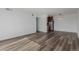 A spacious living area featuring modern flooring and an open layout to the kitchen at 7755 E Quincy Ave # 308A5, Denver, CO 80237