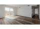 Spacious living room with modern flooring and access to balcony and other rooms at 7755 E Quincy Ave # 308A5, Denver, CO 80237