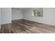 A bright living room features modern lighting, windows, and beautiful flooring at 7755 E Quincy Ave # 308A5, Denver, CO 80237