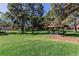 Beautiful community park featuring lush green lawns, mature trees, and picnic areas with BBQ grills at 7755 E Quincy Ave # 308A5, Denver, CO 80237