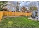 Spacious backyard with a lush green lawn, hammock, and patio area for outdoor living at 10743 W Berry Pl, Littleton, CO 80127