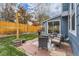 Charming backyard with patio, outdoor furniture, grassy area, and privacy fence at 10743 W Berry Pl, Littleton, CO 80127