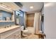 Cozy bathroom featuring a shower-tub combination, vanity with sink, and tile flooring at 10743 W Berry Pl, Littleton, CO 80127