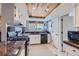 Updated kitchen with wood ceiling, granite counters, and stainless steel appliances at 10743 W Berry Pl, Littleton, CO 80127