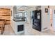 Updated kitchen featuring a custom wood ceiling, stone counters and stainless steel appliances at 10743 W Berry Pl, Littleton, CO 80127