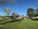 Enjoy outdoor fun at the playground with picnic shelter, surrounded by green space and mature trees under a clear blue sky at 10743 W Berry Pl, Littleton, CO 80127