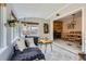 Bright sunroom featuring access to the dining room, a sitting area, and lots of light at 10743 W Berry Pl, Littleton, CO 80127