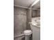 Modern bathroom featuring a vessel sink, stylish mirror, and a tiled shower at 1200 S Patton Ct, Denver, CO 80219