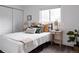 Inviting bedroom with a comfortable bed, decorative pillows, and warm lighting at 1200 S Patton Ct, Denver, CO 80219