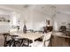 Open dining area featuring modern furniture and smooth hardwood floors at 1200 S Patton Ct, Denver, CO 80219