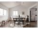 Bright dining area featuring modern furnishing, hard wood floors, and natural light at 1200 S Patton Ct, Denver, CO 80219