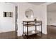 A wheeled serving table between a bathroom and a laundry room at 1200 S Patton Ct, Denver, CO 80219