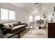 Inviting open-concept living room showcases hardwood floors, vaulted ceilings, and lots of natural light at 1200 S Patton Ct, Denver, CO 80219