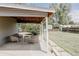 Covered patio featuring stylish outdoor seating and decorative string lights at 1200 S Patton Ct, Denver, CO 80219