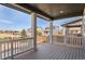 Covered back porch providing relaxing outdoor living space with backyard views at 455 N Old Hammer St, Aurora, CO 80018