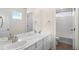 Bathroom featuring double sinks with a marble countertop and white cabinets at 455 N Old Hammer St, Aurora, CO 80018