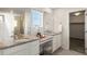 Luxurious bathroom with double vanity, granite countertops, and a separate glass-enclosed shower at 455 N Old Hammer St, Aurora, CO 80018