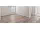 Spacious bedroom with light wood floors, neutral walls, and ample natural light at 455 N Old Hammer St, Aurora, CO 80018