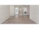 Bright hallway with hardwood floors and open doorways leading to various rooms at 455 N Old Hammer St, Aurora, CO 80018