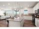 Bright, open kitchen featuring a large island with granite countertops and stainless steel appliances at 455 N Old Hammer St, Aurora, CO 80018