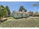 Spacious backyard with a well-maintained lawn and a view of the home's exterior at 19383 E Chaffee Pl, Denver, CO 80249