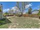 Large, fenced backyard with potential for outdoor activities and landscaping at 19383 E Chaffee Pl, Denver, CO 80249