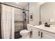 Bathroom with modern sink and faucet fixture, tiled shower, and toilet at 19383 E Chaffee Pl, Denver, CO 80249