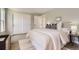 Bedroom with light-colored walls, wood floors, and a closet at 19383 E Chaffee Pl, Denver, CO 80249