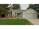 Charming single-story home with a two-car garage and well-maintained front yard at 19383 E Chaffee Pl, Denver, CO 80249