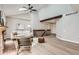 Inviting living room with vaulted ceiling, wood beam, and open staircase at 19383 E Chaffee Pl, Denver, CO 80249