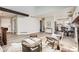 Bright living room with vaulted ceilings, wood beams, and an open floor plan at 19383 E Chaffee Pl, Denver, CO 80249