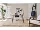 Office space with a modern desk, office chair, house plant, and decor at 19383 E Chaffee Pl, Denver, CO 80249