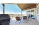Inviting outdoor balcony area with comfortable seating and a scenic view of the surrounding landscape at 220 High Meadows Loop, Elizabeth, CO 80107