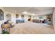 Spacious basement area featuring a wet bar, ample seating, and a stone fireplace with a TV at 220 High Meadows Loop, Elizabeth, CO 80107