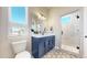 Bathroom featuring blue vanity with white countertop, and patterned tile floor at 220 High Meadows Loop, Elizabeth, CO 80107
