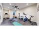 Well-equipped exercise room with rubber flooring, a ceiling fan, and various fitness machines at 220 High Meadows Loop, Elizabeth, CO 80107