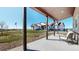 Inviting covered patio with a comfortable chair and scenic views, perfect for outdoor relaxation at 220 High Meadows Loop, Elizabeth, CO 80107