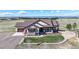 Charming single-Gathering home with a well-manicured lawn and stone accents, complete with an American flag at 220 High Meadows Loop, Elizabeth, CO 80107