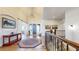 Elegant foyer with hardwood floors, high ceilings, stylish light fixture, and staircase at 220 High Meadows Loop, Elizabeth, CO 80107