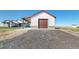 Detached garage with a covered carport area, offering ample parking and storage space at 220 High Meadows Loop, Elizabeth, CO 80107