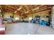 Spacious garage interior with exposed framing, a concrete floor and organized storage areas at 220 High Meadows Loop, Elizabeth, CO 80107