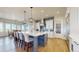 Bright open-concept kitchen with island seating, stylish pendant lights, and stainless appliances offers both functionality and style at 220 High Meadows Loop, Elizabeth, CO 80107