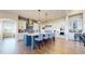 Spacious kitchen boasts a large island with seating, stainless steel appliances, and custom cabinetry with an exquisite backsplash at 220 High Meadows Loop, Elizabeth, CO 80107