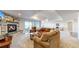 Inviting living room showcasing a stone fireplace, comfortable seating, and access to the outdoor patio at 220 High Meadows Loop, Elizabeth, CO 80107